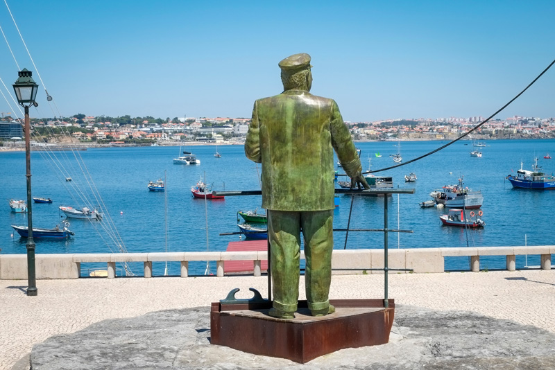 Cascais, Portugal. Statue overlooks the bay at Cascais.