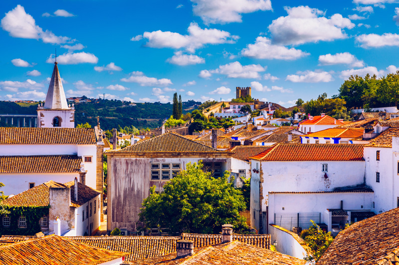 Obidos, Portugal stonewalled city with medieval fortress, historic walled town of Obidos, near Lisbon, Portugal. Beautiful view of Obidos Medieval Town, Portugal.