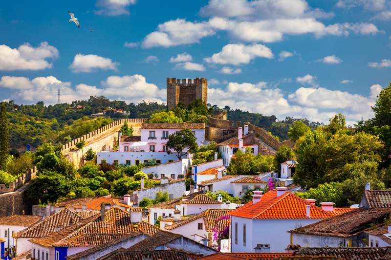 Obidos, Portugal stonewalled city with medieval fortress, historic walled town of Obidos, near Lisbon, Portugal. Beautiful view of Obidos Medieval Town, Portugal.